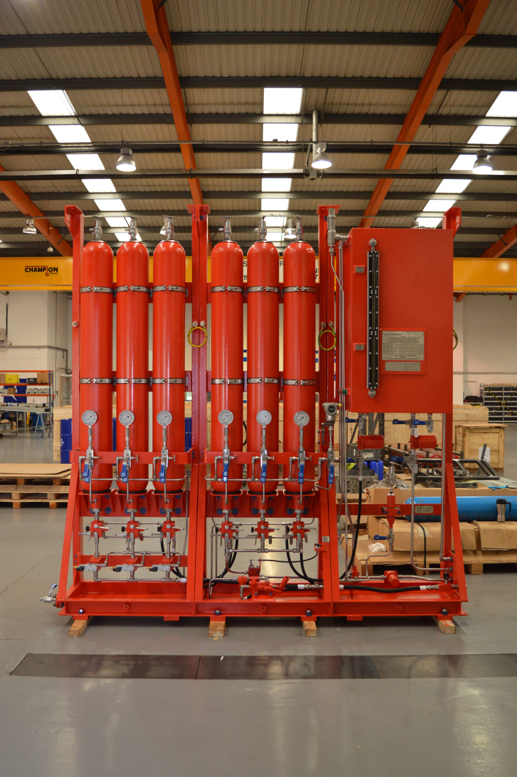 Red eight cylinder hydraulic starting system with control cabinet, built for reliable engine cranking