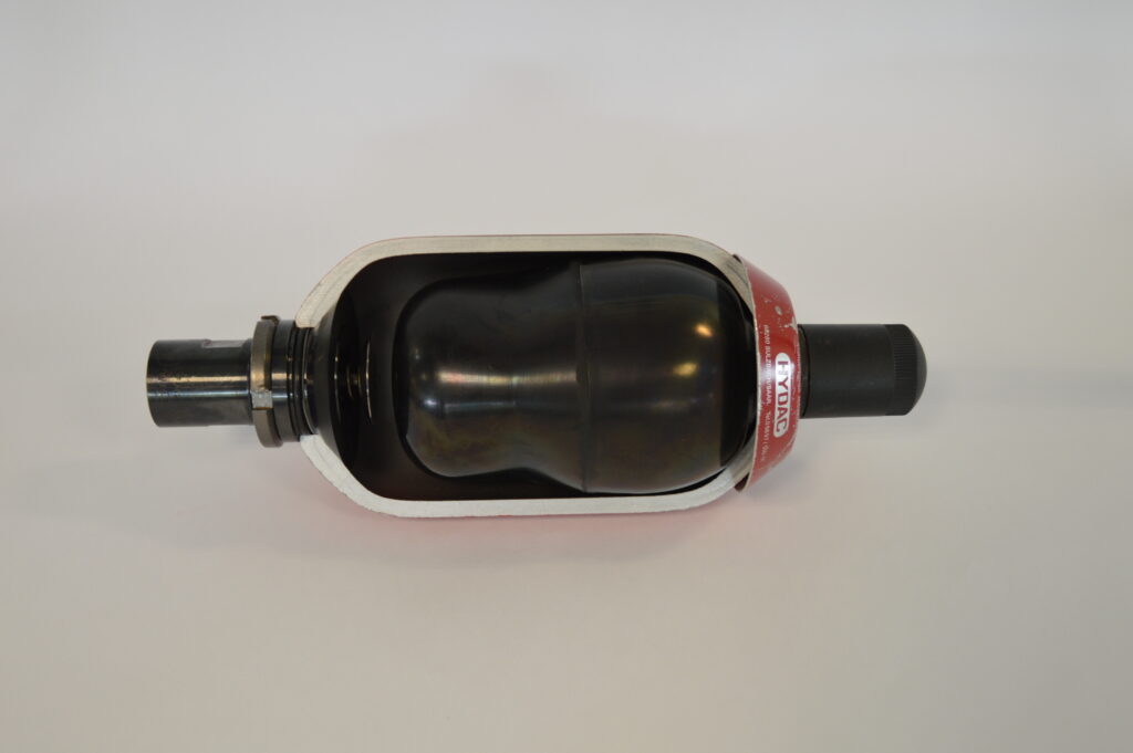 Cutaway of a bladder accumulator showing the nitrogen gas bladder that pressurises the hydraulic fluid