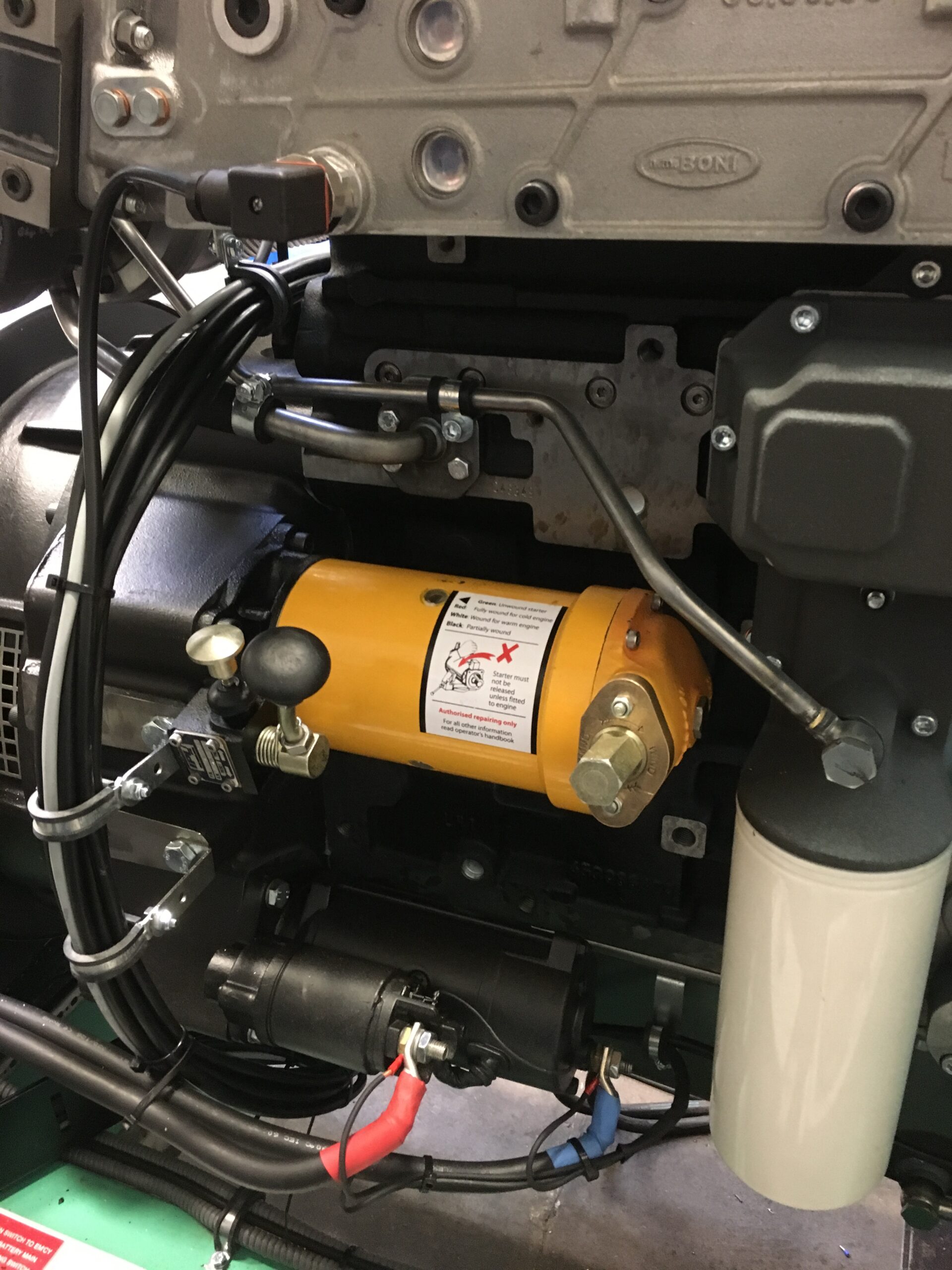 Powerstart spring starter fitted to a diesel engine, cranked by a wound spring with no electrical supply