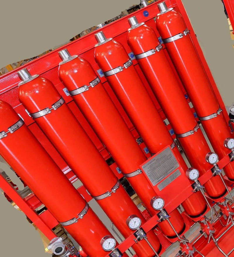 Red hydraulic accumulator cylinders mounted on a Powerstart M-Series starting system frame